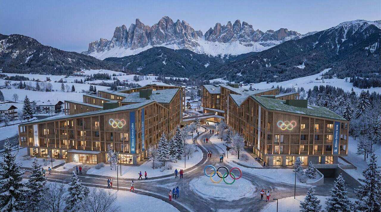 Palazzi olimpici e sedi dei Giochi Invernali Milano-Cortina 2026 con la fiamma olimpica